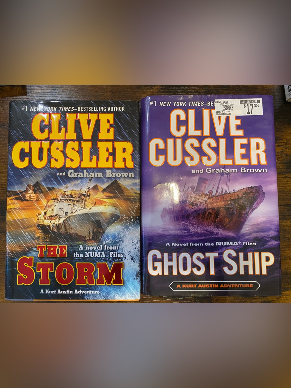 📘 Clive Cussler & Graham Brown Hardcover Book Bundle - The Storm & Ghost Ship 📗
